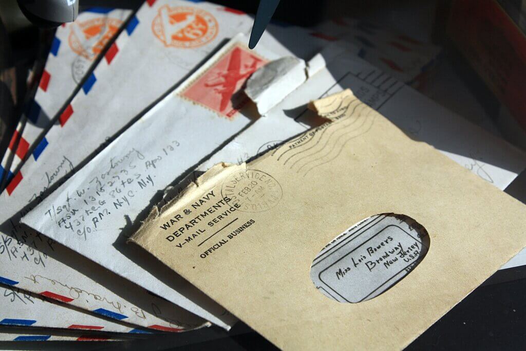 A stack of envelopes with address